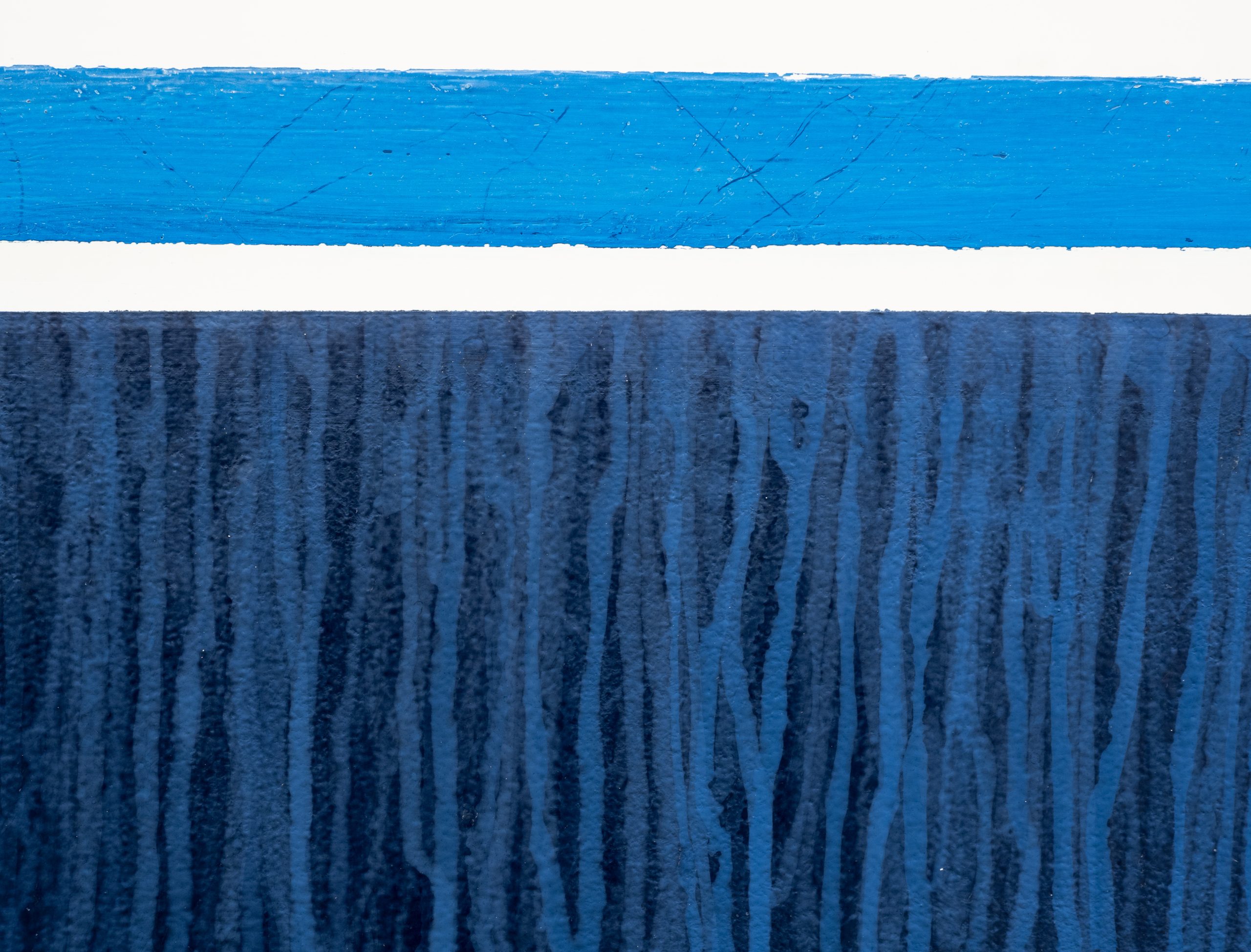 An abstract like photograph featuring a close up of the hull line of a boat. This creates an image of four stripes. A narrow white, then wider cyan, a narrow white, then a big band of royal blue that is about three quarters of the image, with lighter blue paint marks dripping down